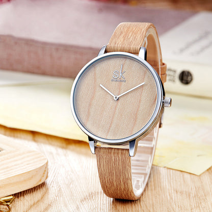 Reloj de cuarzo para mujer con aguja de madera.