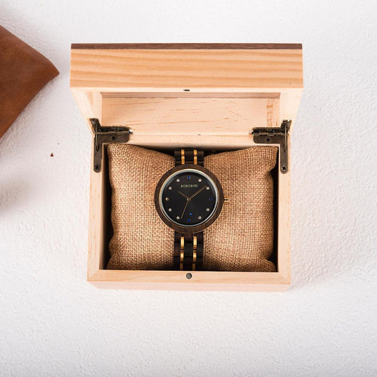 BOBO BIRD Reloj de oro y madera entre estrellas